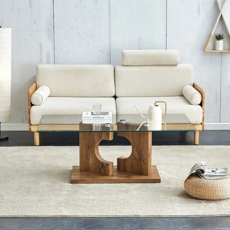 A rectangular modern coffee table with tempered glass tabletop and wooden color MDF legs. Suitable for living room.